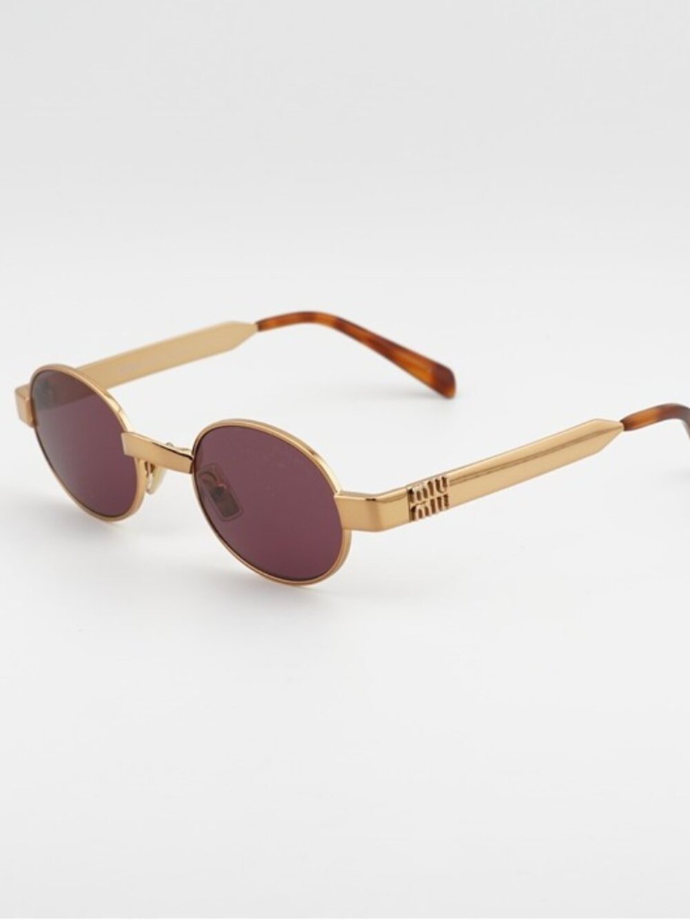 Miu Miu MUB51S 7OE30Y Sunglasses Brass Oval Frame, Dark Violet Lenses